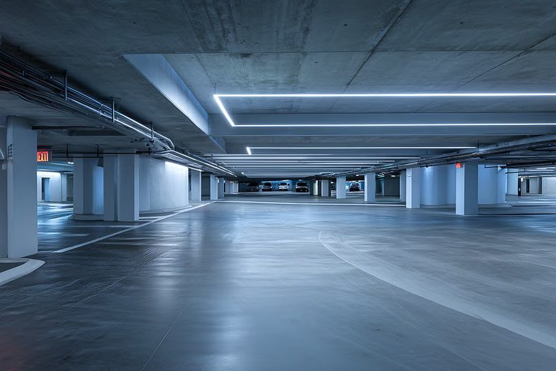Secured commercial parking garage with access reader and cameras