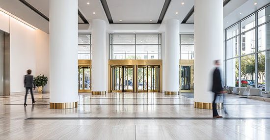 Office tenant entering secured lobby with mobile credential