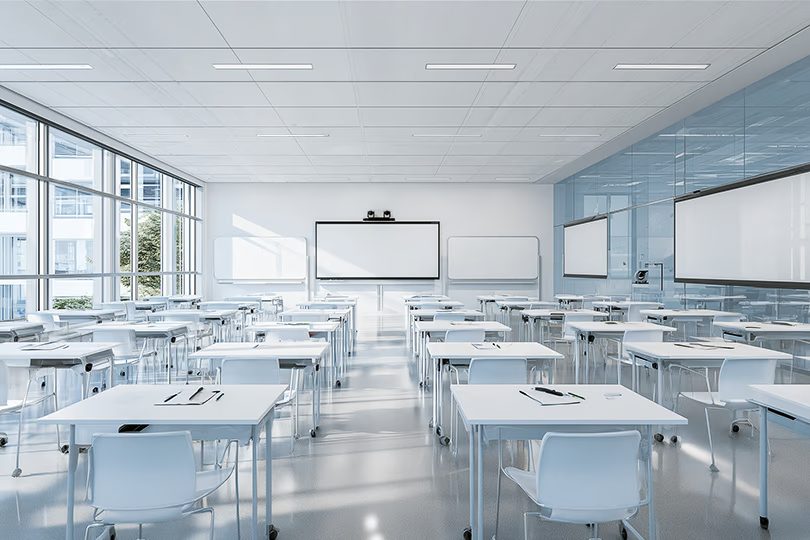 Bright standardized classroom with interactive display and camera tracking