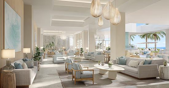 South Florida resort lobby flowing into outdoor terrace with warm ambient lighting