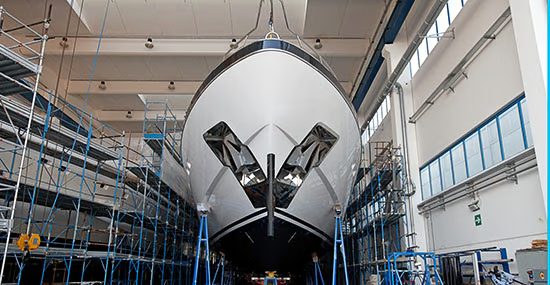 Luxury yacht in dry dock during technology refit and upgrade period.