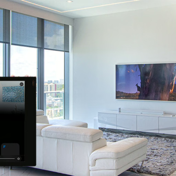 Crestron touchpanel, wall-mounted TV, motorized shades, and lighting control in a Sunny Isles residence